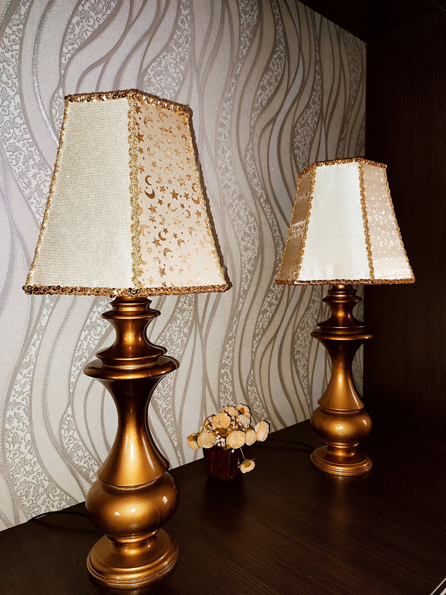 Table lamp. Golden celestial lamp with shimmering moons and stars on a delicate fabric. The wooden base is bronze in color. 7701