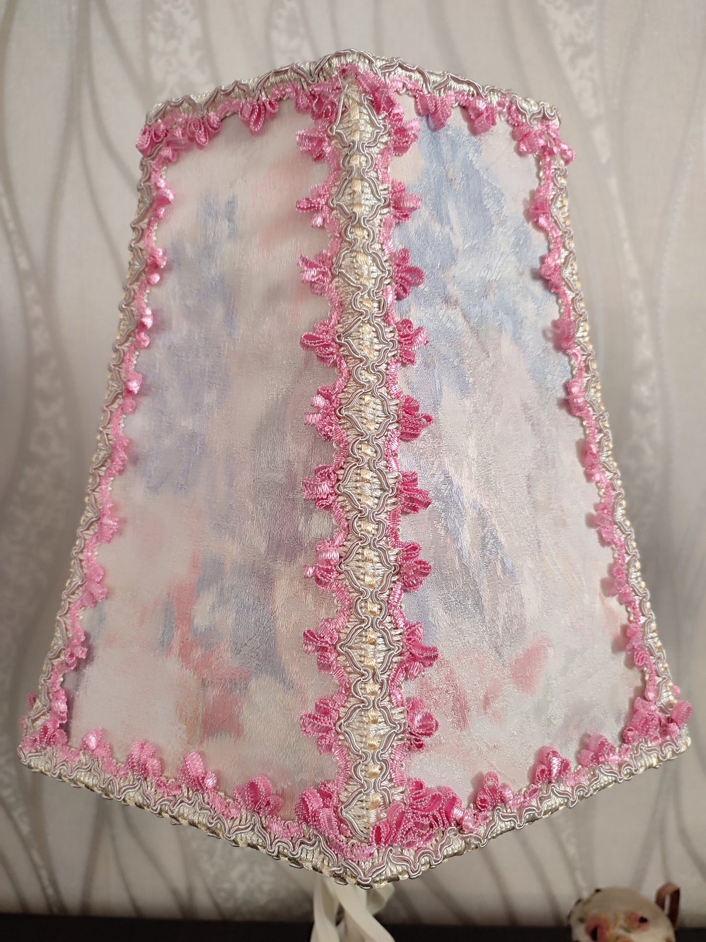 Table lamp. Pink table lamp with a wrought iron spiral base, a fabulous lamp. 7702
