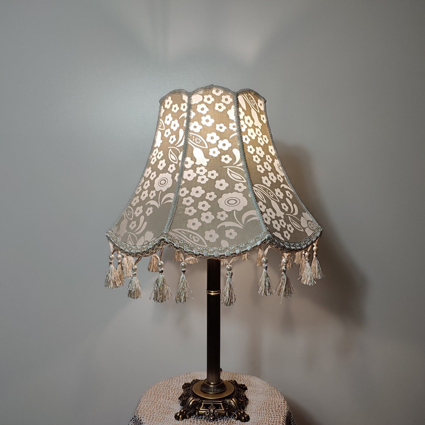 Vintage-inspired floral Lace Table Lamp with Tassel Detail and Antique Brass Base. 2002