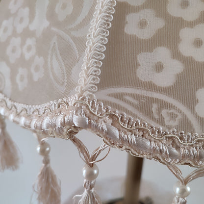 Vintage-inspired floral Lace Table Lamp with Tassel Detail and Antique Brass Base. 2002