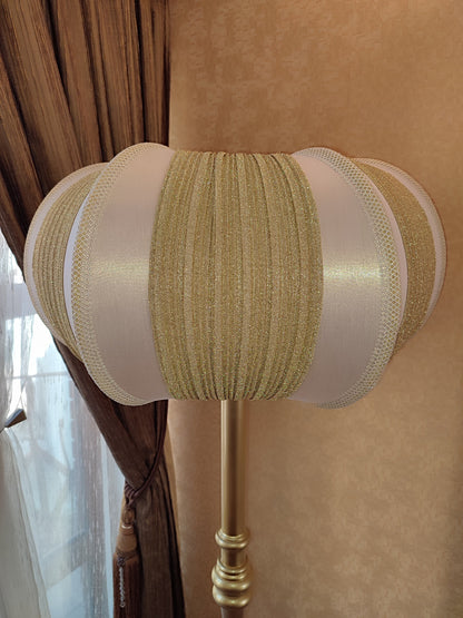 A two-tone creamy golden lampshade, delicate crystal beads and an elegant wooden base add a touch of luxurious radiance 2206