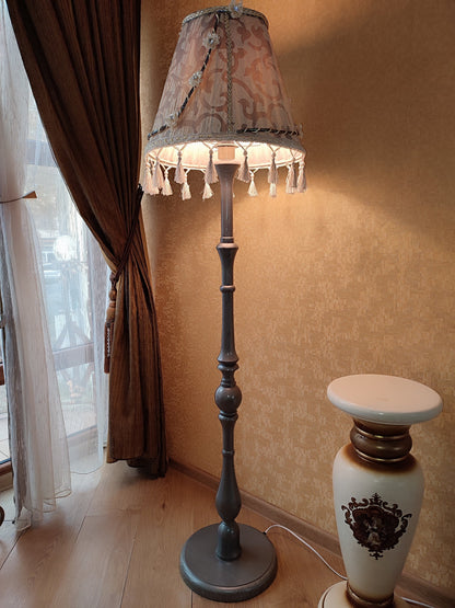 Floor lamp with an exquisite Victorian shade decorated with elegant tassels