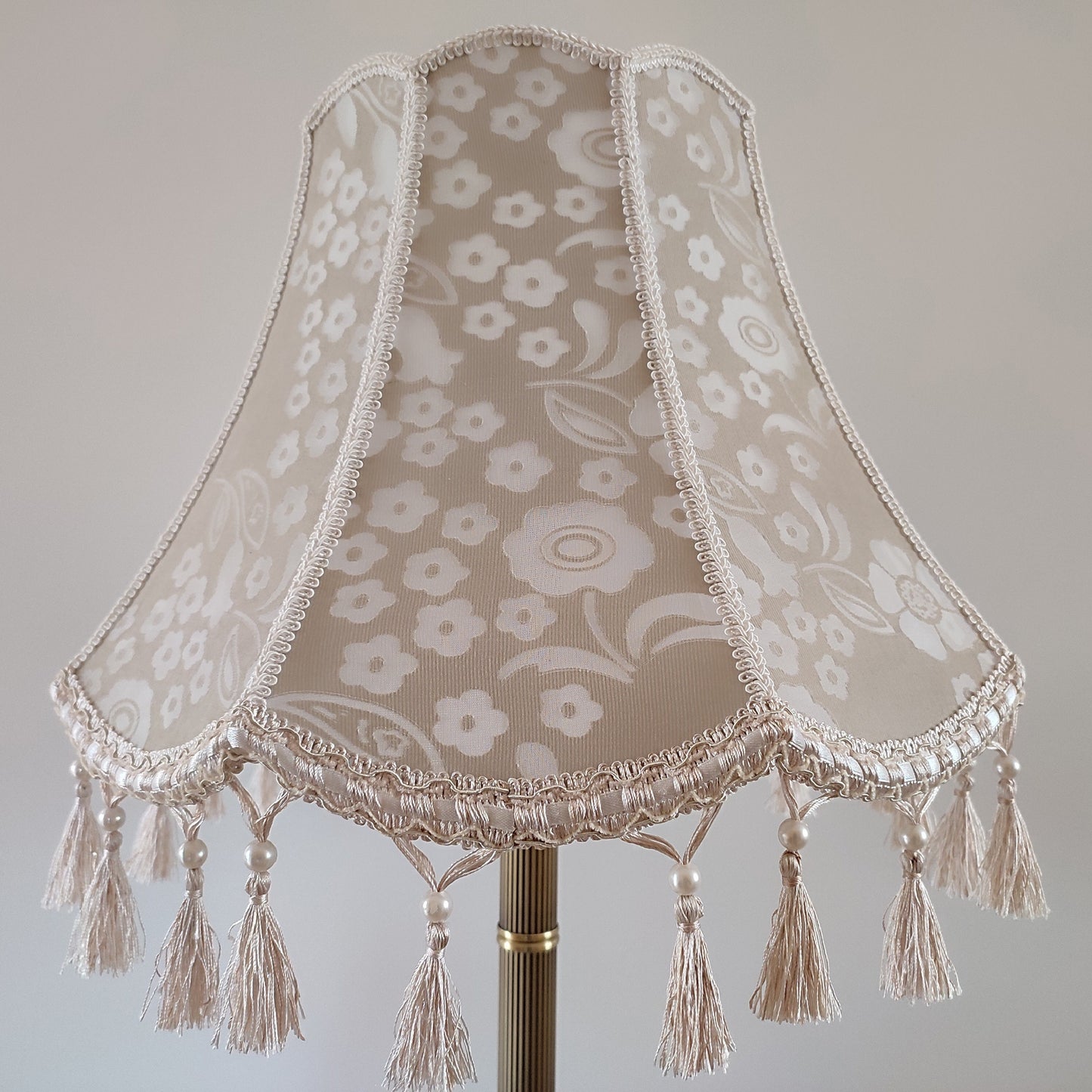 Vintage-inspired floral Lace Table Lamp with Tassel Detail and Antique Brass Base. 2002