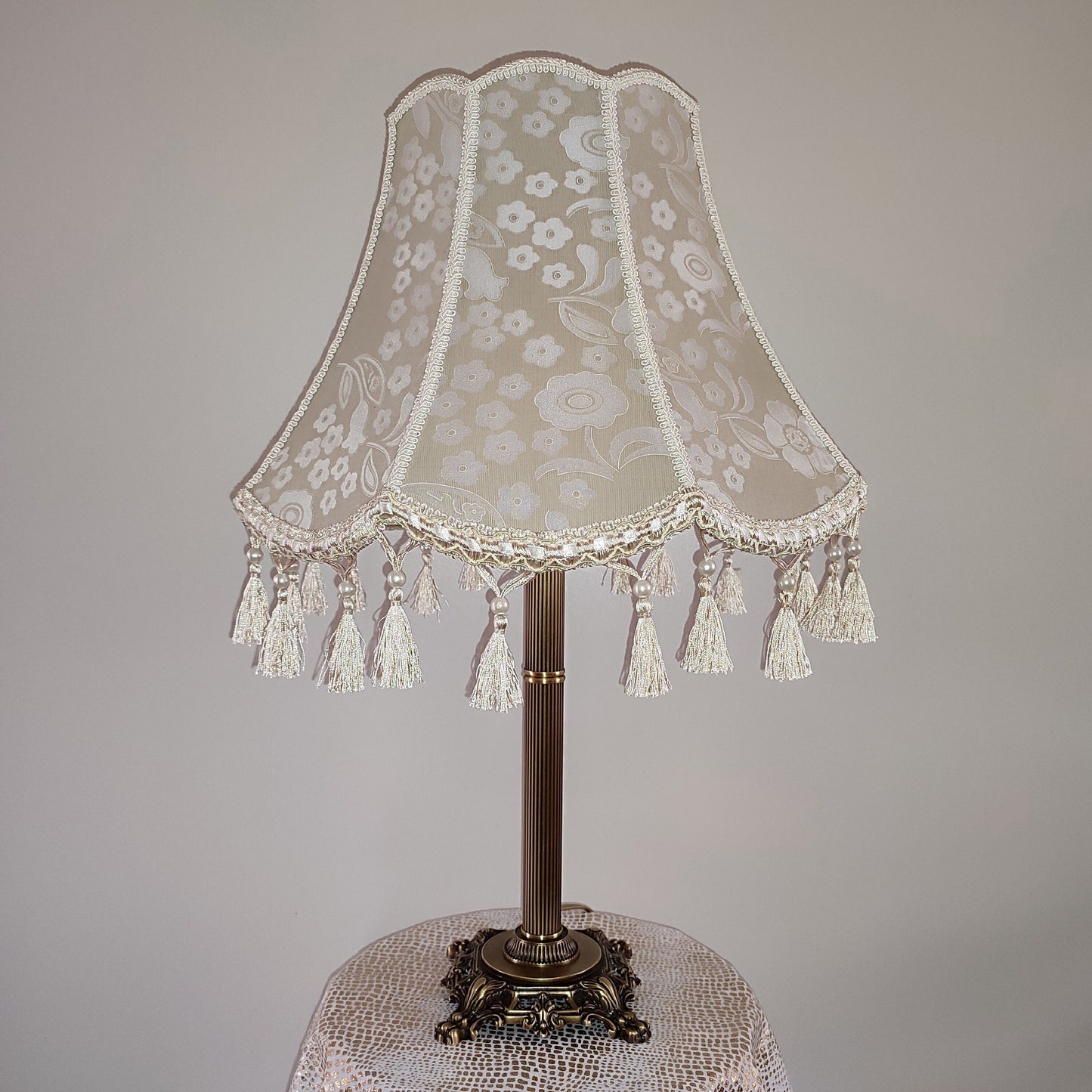 Vintage-inspired floral Lace Table Lamp with Tassel Detail and Antique Brass Base. 2002