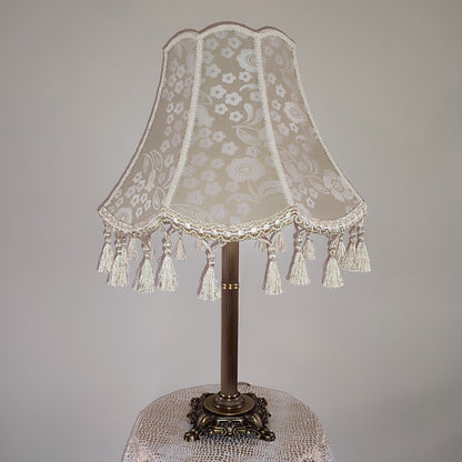 Vintage-inspired floral Lace Table Lamp with Tassel Detail and Antique Brass Base. 2002